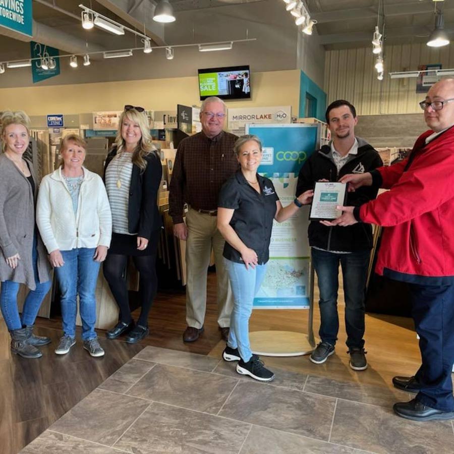Carpet One store owners accept award for local community service