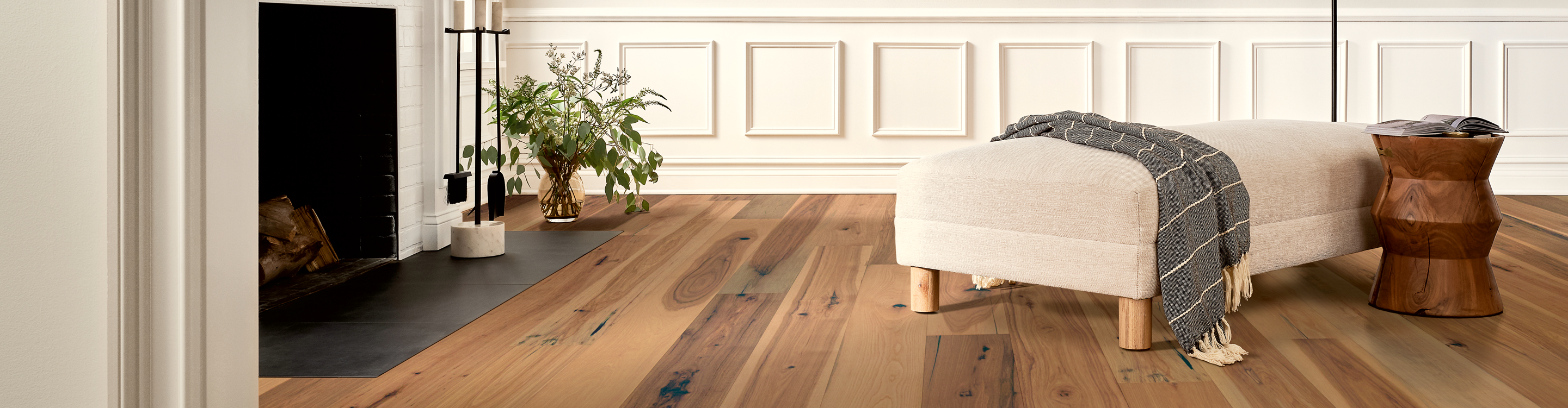 Oak hardwood floor with cream ottoman 